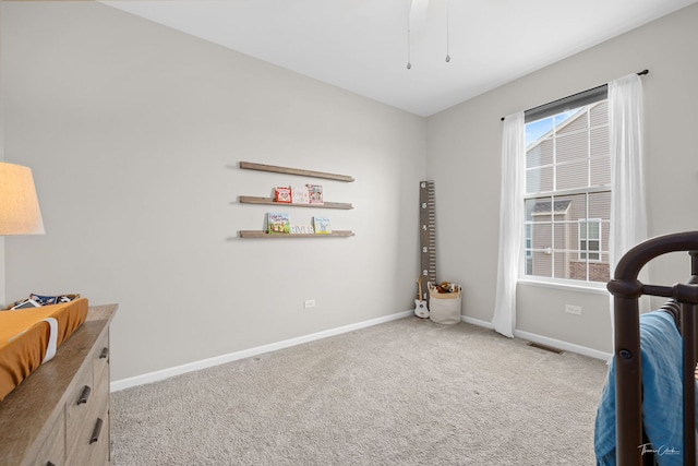 bedroom with baseboards, visible vents, and carpet flooring