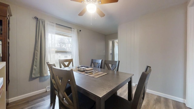 dining room featuring dark hardwood / wood-style floors and ceiling fan