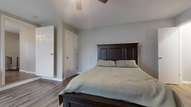 bedroom featuring wood-type flooring and ceiling fan