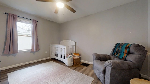 bedroom featuring ceiling fan and wood-type flooring