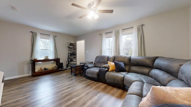 living room with ceiling fan and hardwood / wood-style floors