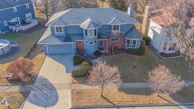 view of front of house with a garage and a front yard