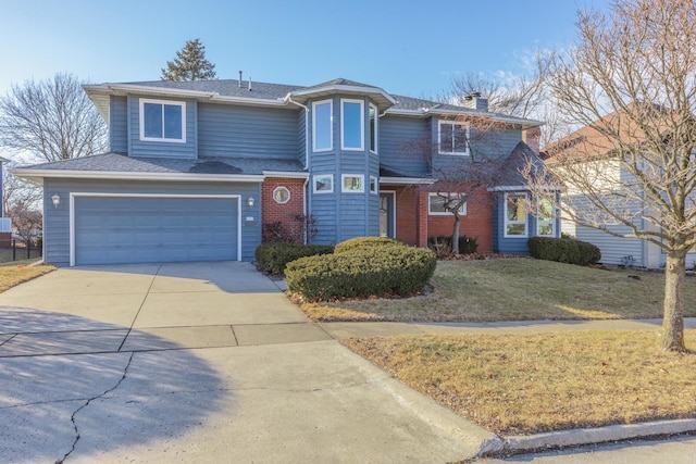 view of property featuring a garage and a front yard