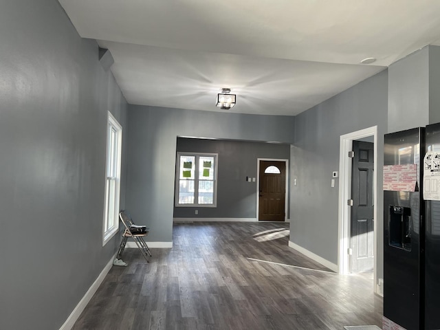 interior space with dark hardwood / wood-style flooring