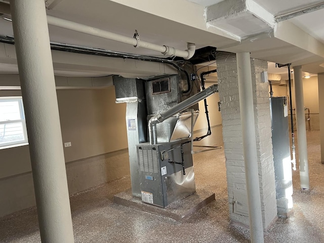 utility room featuring heating unit