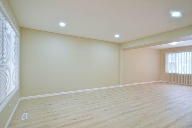 unfurnished room with light hardwood / wood-style flooring