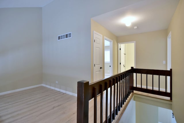 staircase featuring wood-type flooring