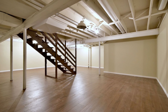 basement with hardwood / wood-style flooring