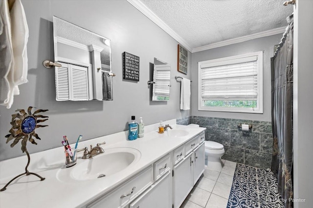 bathroom featuring crown molding, tile walls, vanity, a textured ceiling, and tile patterned floors