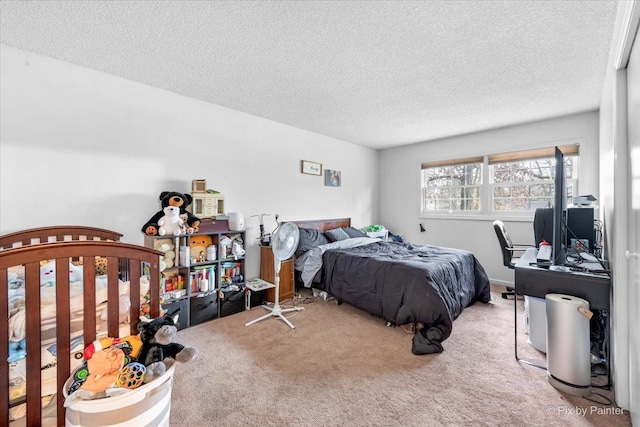 bedroom with carpet and a textured ceiling