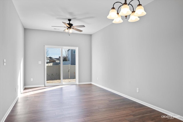 unfurnished room with dark wood-type flooring and ceiling fan with notable chandelier