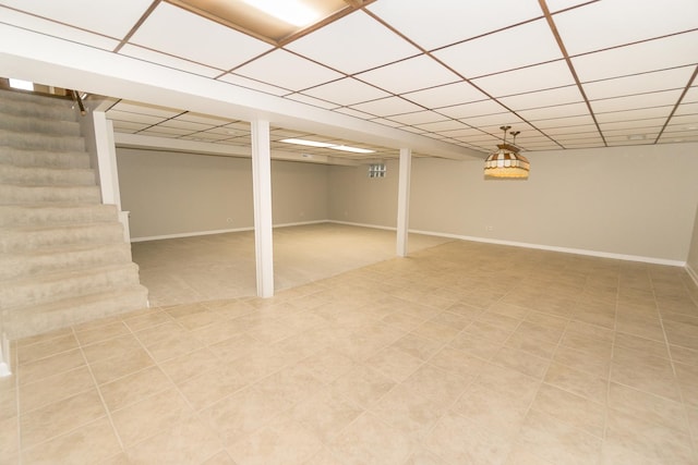 basement featuring a drop ceiling