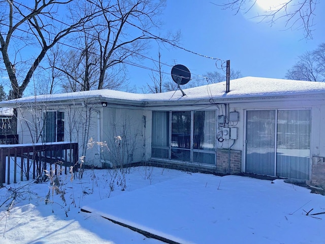 view of snow covered house