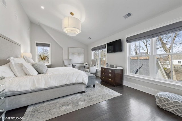 bedroom featuring baseboards, visible vents, lofted ceiling, and dark wood-type flooring