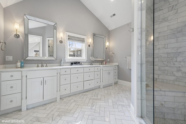 full bath with double vanity, a sink, baseboards, and visible vents
