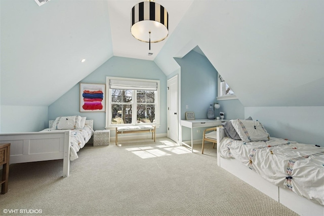 bedroom with carpet floors and lofted ceiling