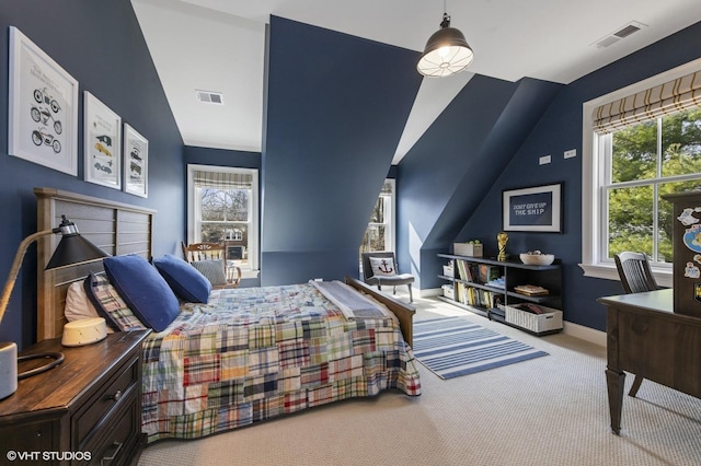 bedroom with baseboards, visible vents, lofted ceiling, and carpet