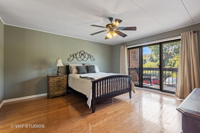 bedroom featuring access to exterior, hardwood / wood-style flooring, and ceiling fan