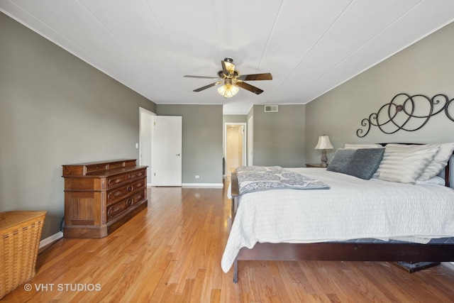 bedroom with ceiling fan and light hardwood / wood-style floors