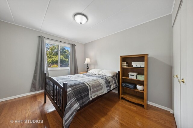 bedroom with hardwood / wood-style flooring