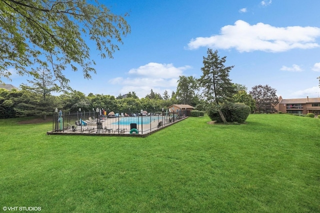 view of yard featuring a fenced in pool