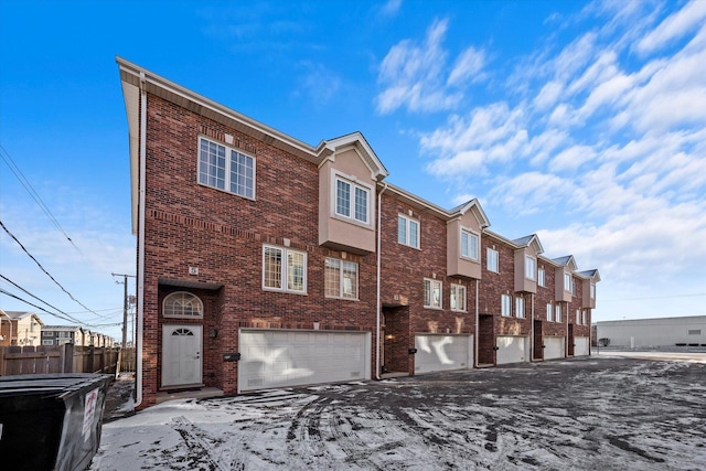 townhome / multi-family property featuring a garage