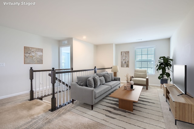 living room featuring light colored carpet