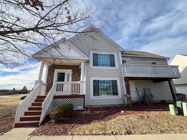 view of front of home with a balcony