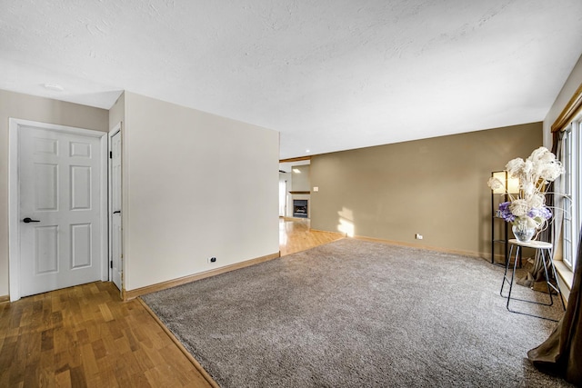 unfurnished living room featuring wood-type flooring