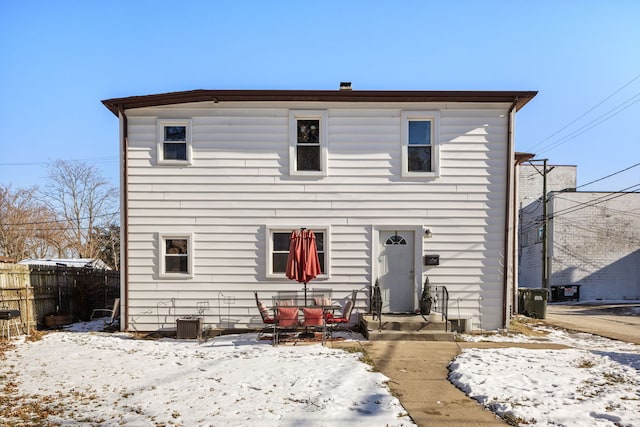 view of front of property featuring central AC unit, fence, and entry steps