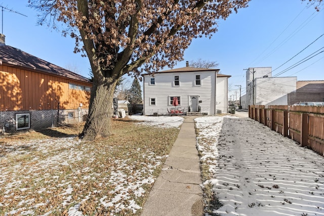 back of property with fence