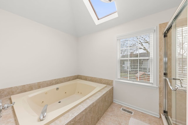 full bath featuring lofted ceiling with skylight, visible vents, plenty of natural light, and a tub with jets