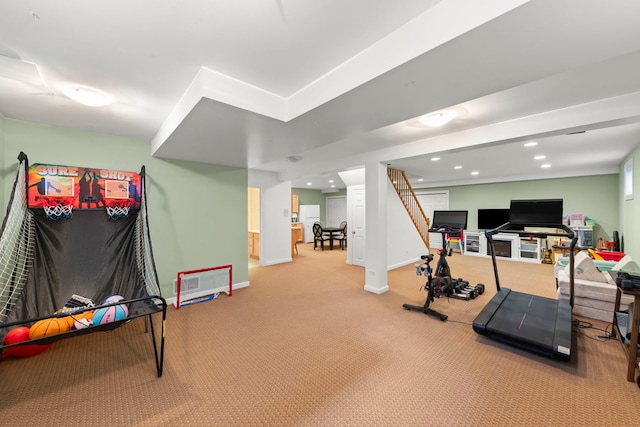 workout room featuring recessed lighting, light colored carpet, and baseboards