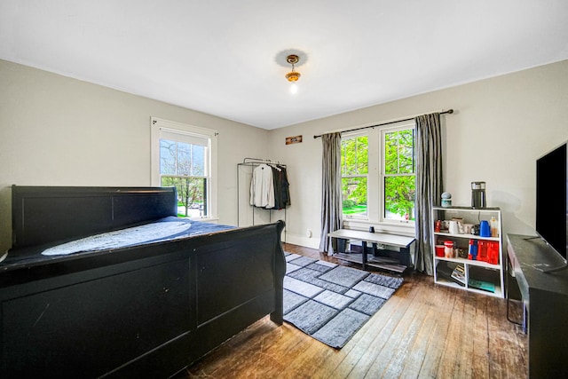bedroom with wood-type flooring