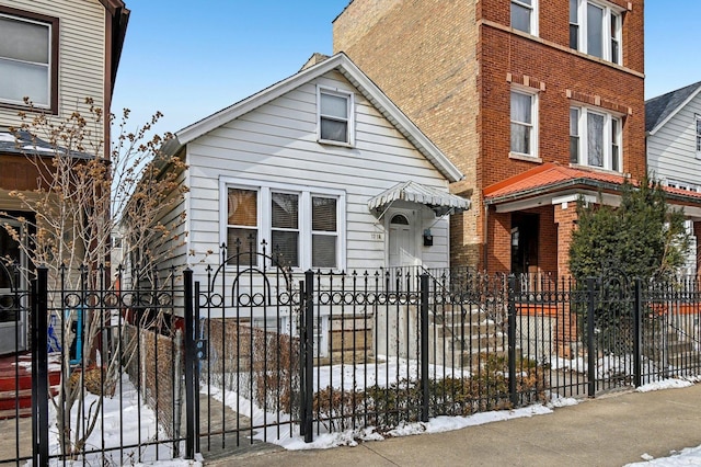 view of front of house featuring a fenced front yard and a gate