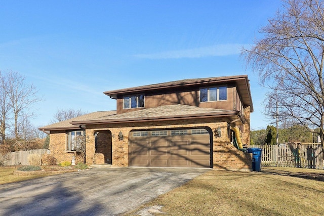 view of front of property with a garage and a front yard