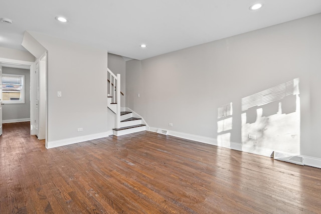 unfurnished living room featuring hardwood / wood-style floors