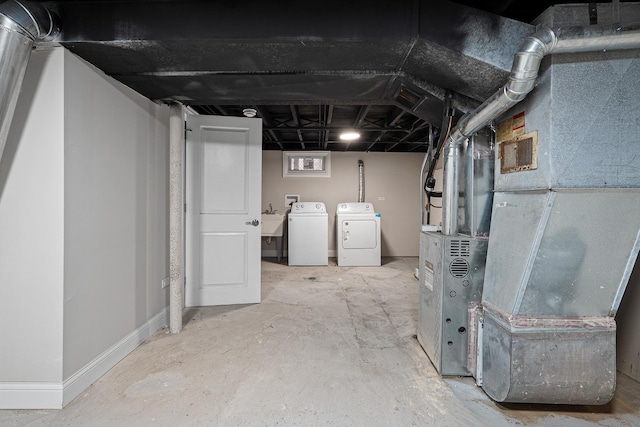 basement featuring sink and washer and clothes dryer