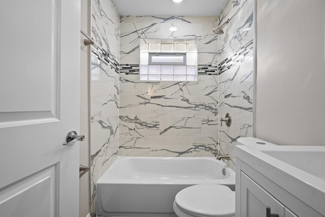 full bathroom with vanity, toilet, and tiled shower / bath