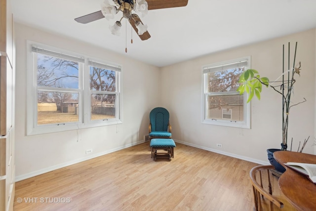 sitting room featuring light hardwood / wood-style flooring and ceiling fan