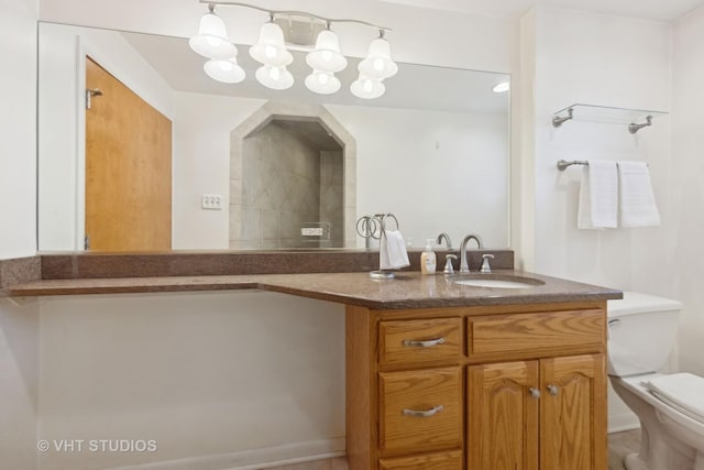 bathroom with vanity and toilet