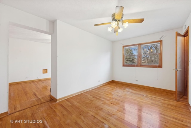 empty room with ceiling fan and light wood-type flooring