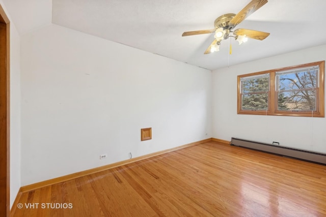 empty room featuring a baseboard radiator, ceiling fan, and light hardwood / wood-style flooring