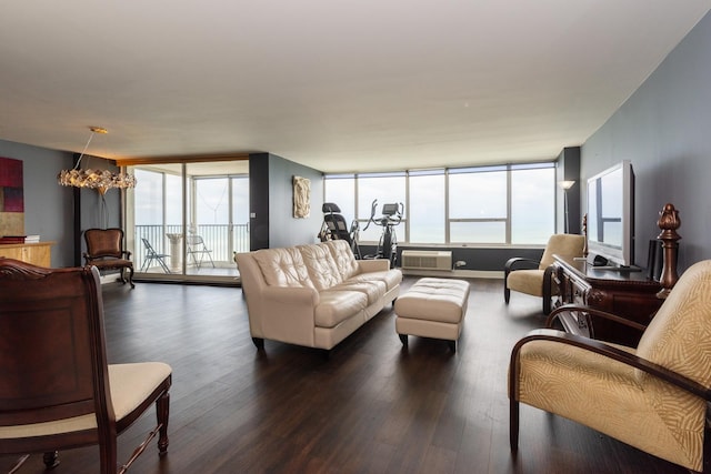 living room with a chandelier and dark hardwood / wood-style flooring