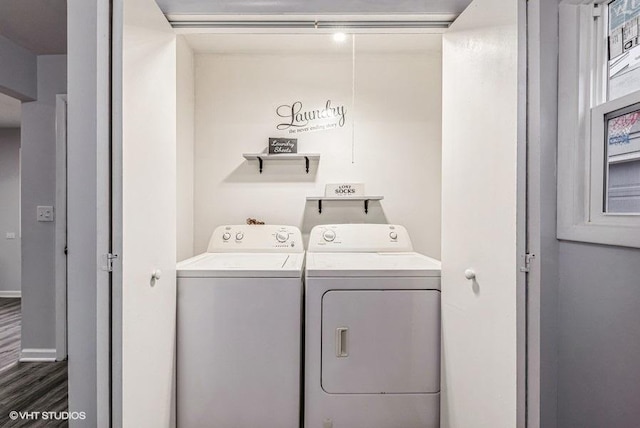 clothes washing area with dark wood-type flooring and washer and dryer