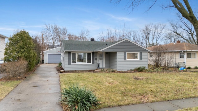 view of front of house with a garage and a front yard