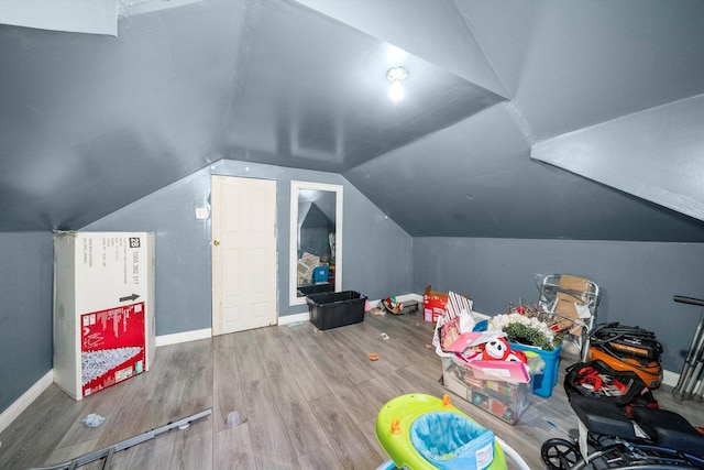 bonus room featuring lofted ceiling and hardwood / wood-style floors