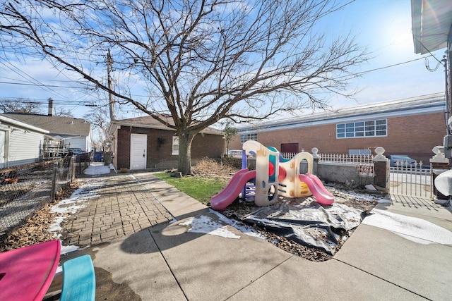 back of house featuring a playground