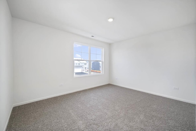 spare room featuring carpet floors