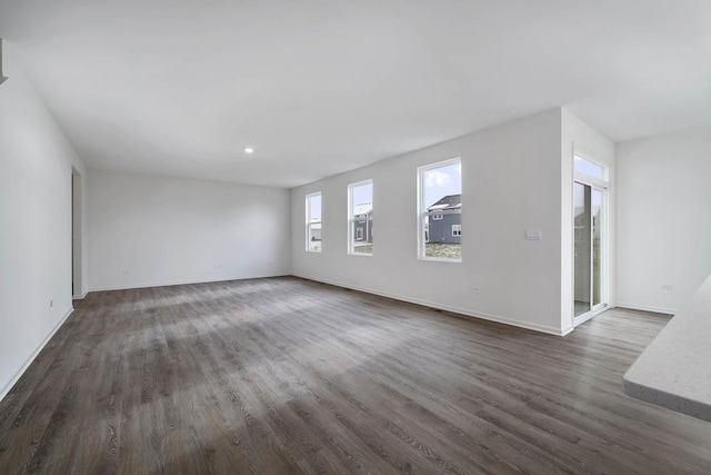 spare room featuring dark hardwood / wood-style flooring